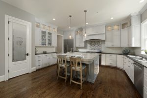 Meridian Homes - Custom Home Kitchen with Glass Pantry Door